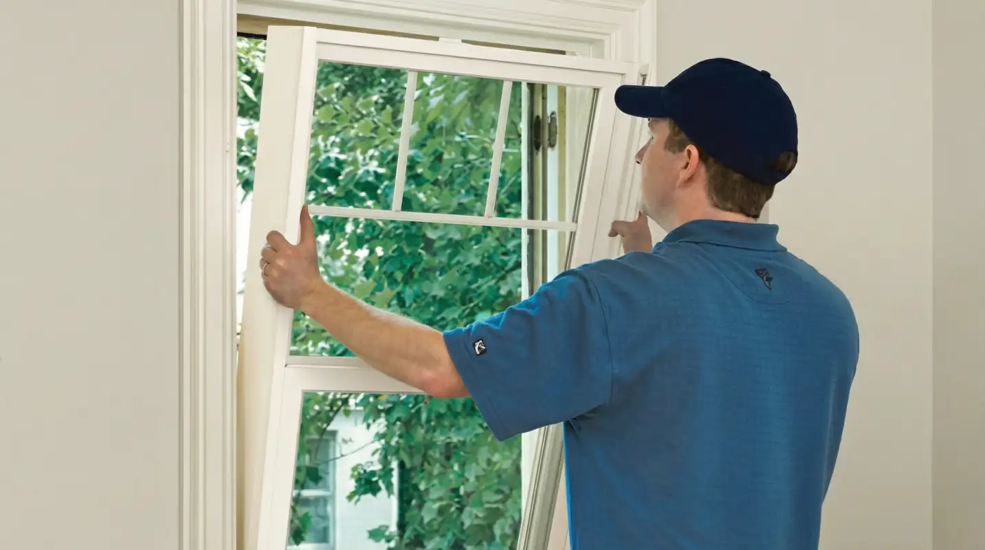 Professional contractors performing a residential window insulation and replacement service in El Paso, TX